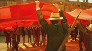 Workers raise their long hidden red banner
